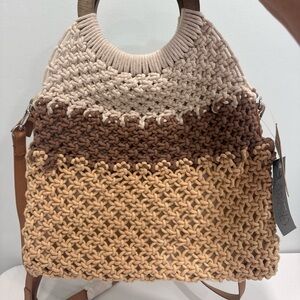 The Crown Vintage Macrame Bucket Bag is a medium-sized crossbody bucket bag